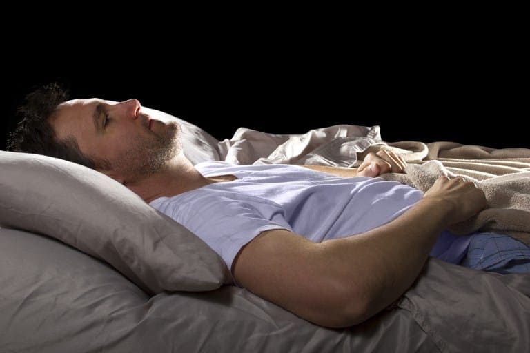 Man Lyning in Bed alone