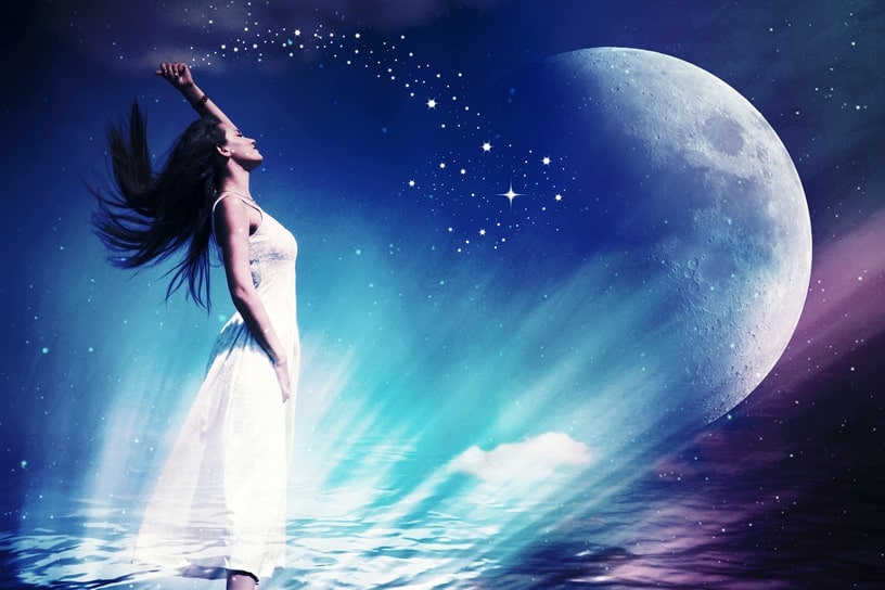 Woman standing in moonlight