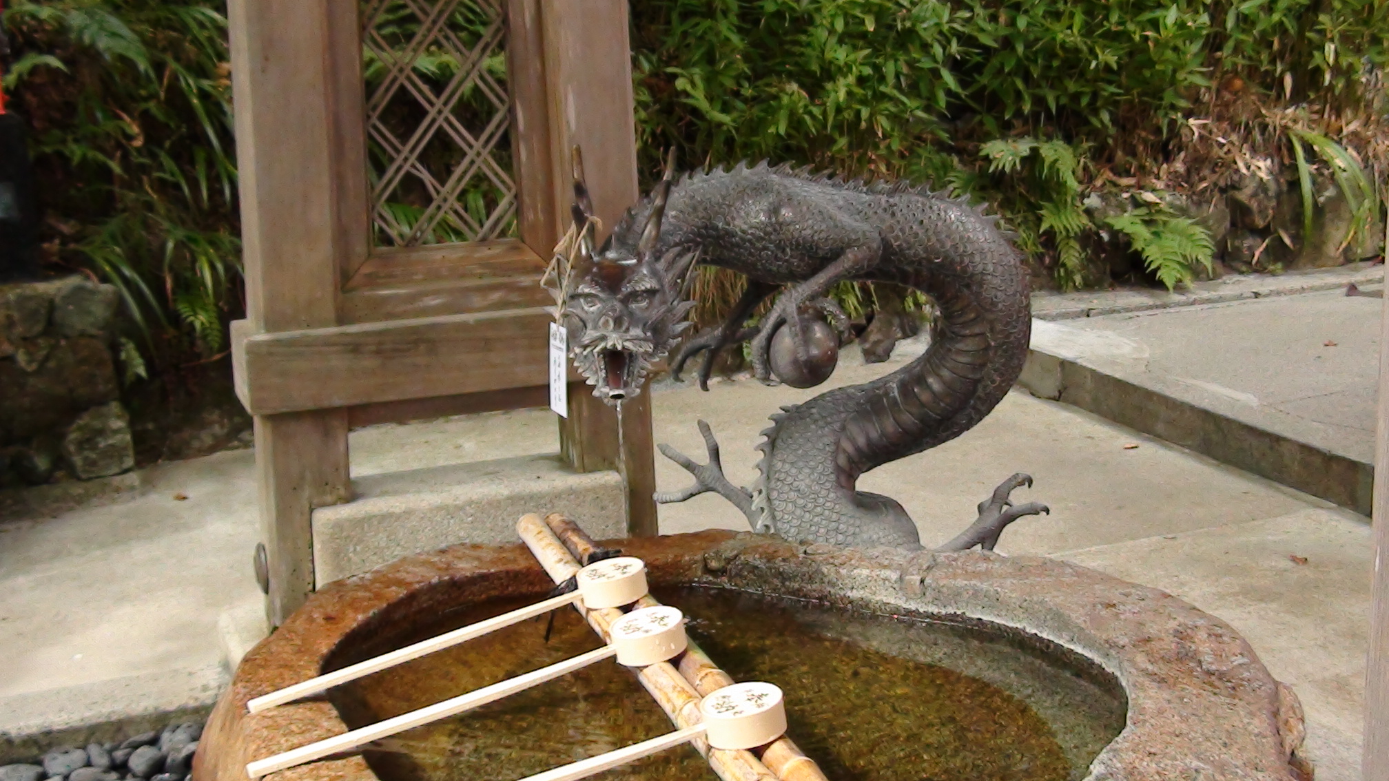 At a sacred temple in Japan, Kyoto, halfway up the mountain, is this sacred well, where the dragon fount is.